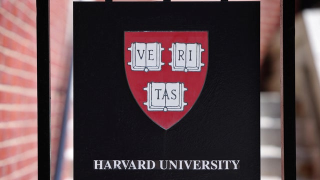 A sign hangs on a gate of a building at Harvard University in Cambridge, Massachusetts, July 6, 2023. 