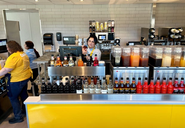Employees work at McDonald's new beverage-led, drive-thru only chain, CosMc's, during the concept's secret opening in Bolingbrook 